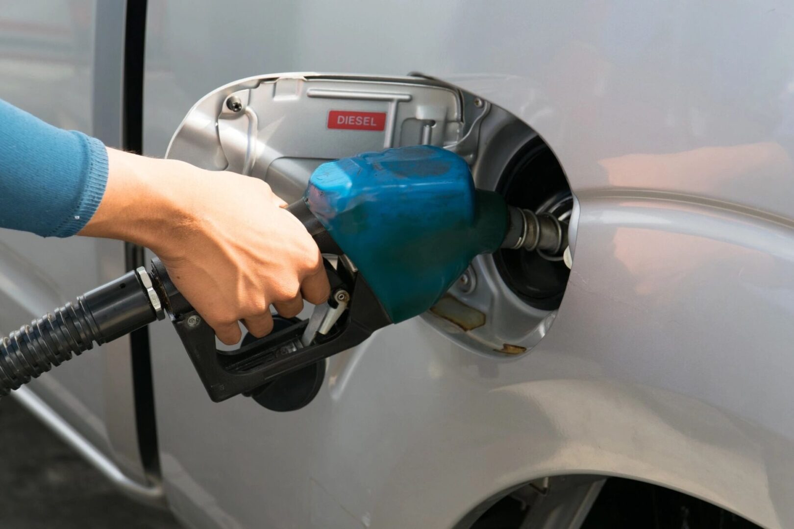 Refueling the car at a gas station fuel pump